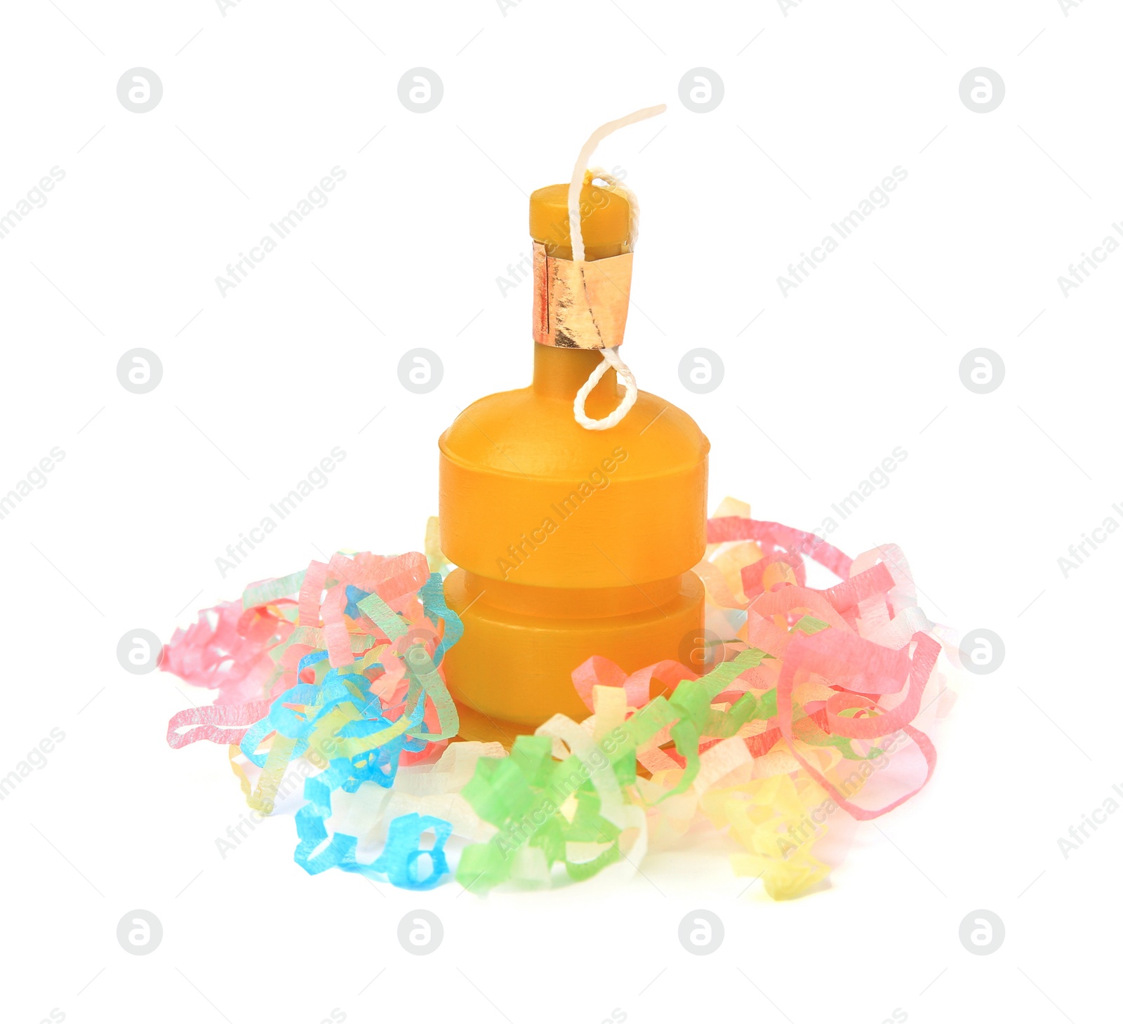 Photo of Colorful streamers with yellow party cracker isolated on white