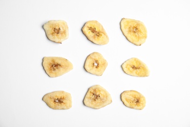 Flat lay composition with banana slices on  white background. Dried fruit as healthy snack