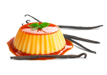 Image of Delicious caramel pudding and vanilla pods isolated on white