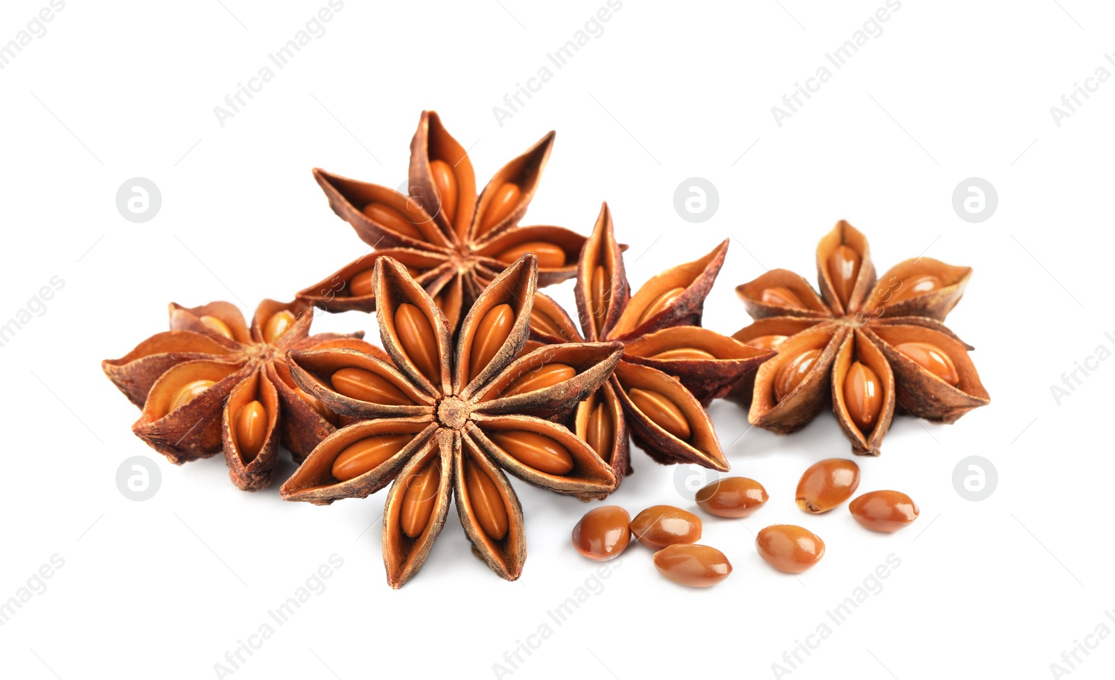 Photo of Dry anise stars with seeds on white background