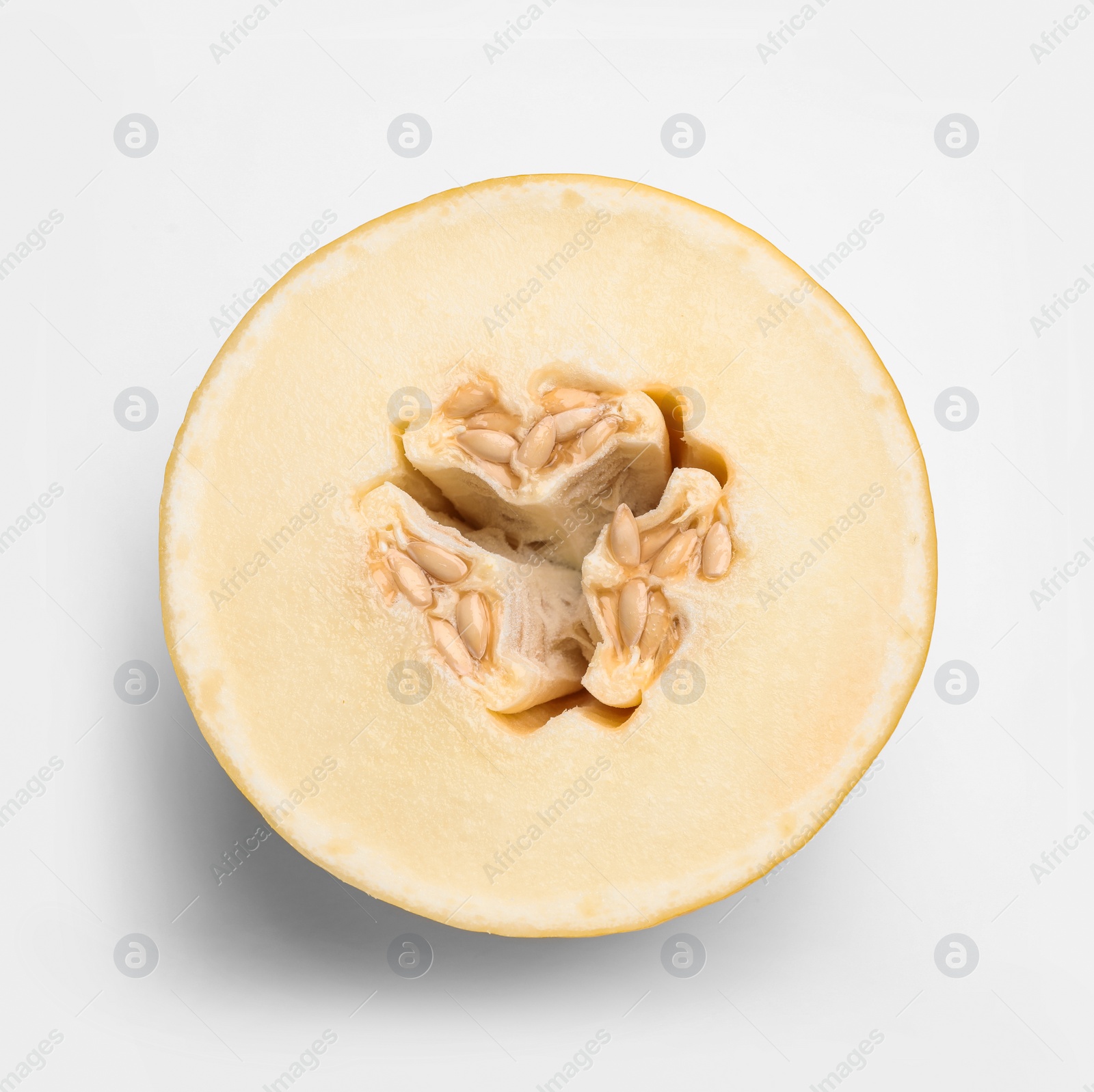 Photo of Half of ripe tasty melon on white background, top view