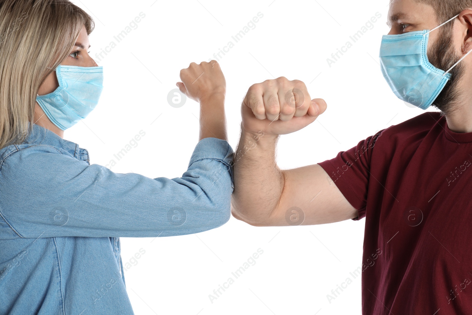 Photo of Man and woman bumping elbows to say hello on white background. Keeping social distance during coronavirus pandemic