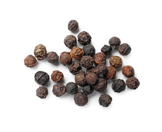 Photo of Aromatic spice. Many black dry peppercorns isolated on white, top view