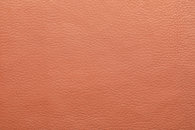 Texture of dark pink leather as background, closeup