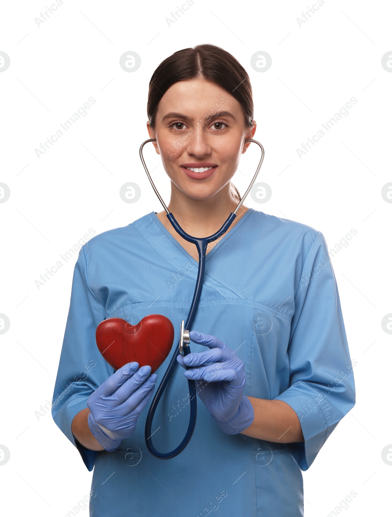 Photo of Doctor with stethoscope and red heart on white background. Cardiology concept