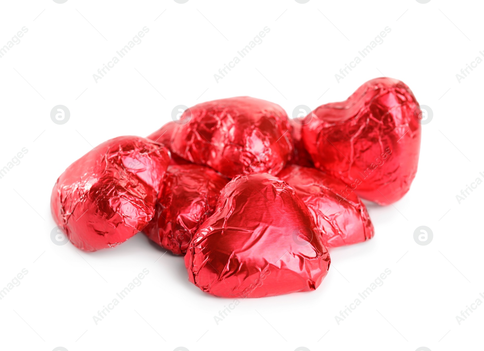 Photo of Heart shaped chocolate candies on white background