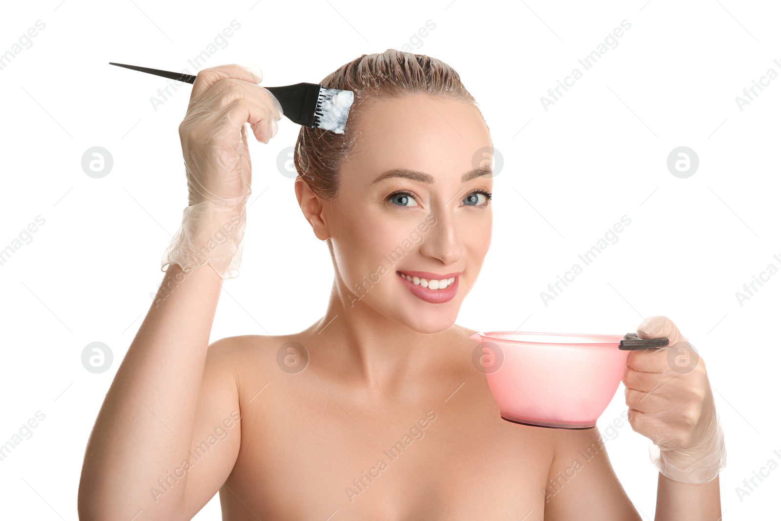 Photo of Young woman dyeing her hair against white background