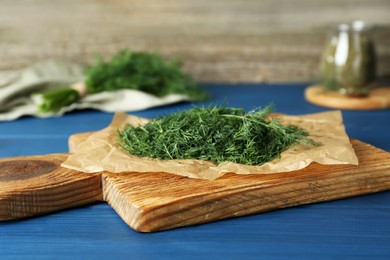 Photo of Fresh dill preparing for drying on wooden board