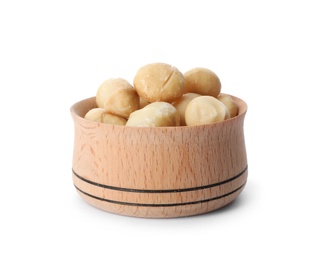 Photo of Bowl with shelled organic Macadamia nuts on white background