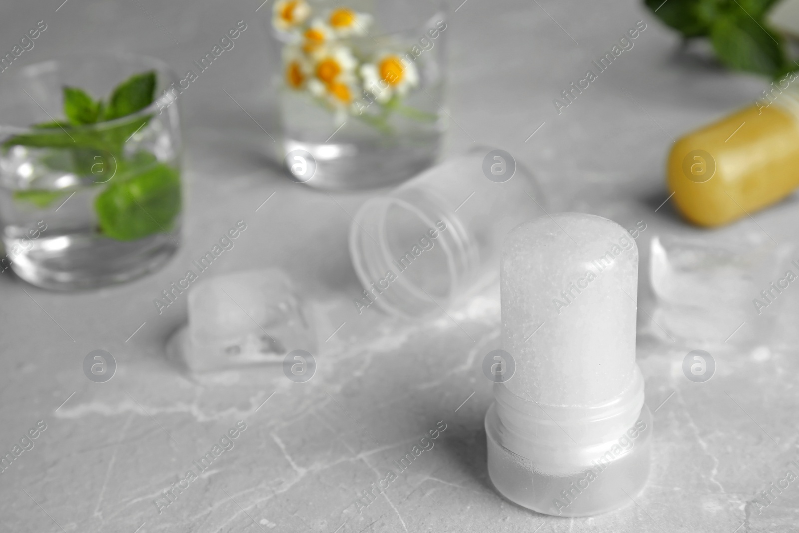 Photo of Natural crystal alum deodorant on light grey marble background