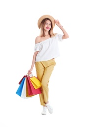 Photo of Beautiful young woman with shopping bags on white background