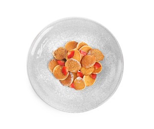 Photo of Delicious mini pancakes cereal with strawberries on white background, top view