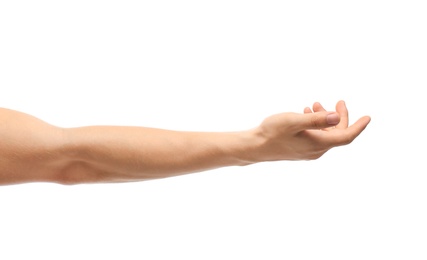 Young man held out hand on white background, closeup