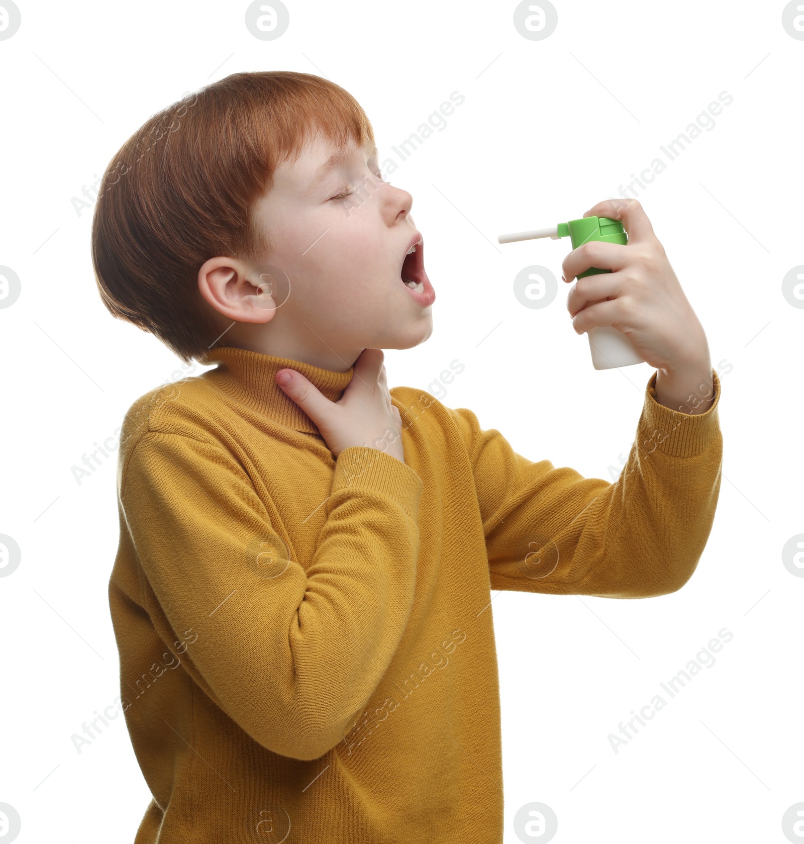 Photo of Little boy using throat spray on white background