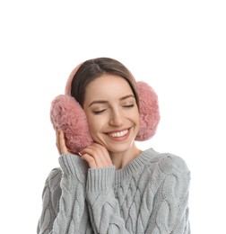 Happy woman wearing warm earmuffs on white background