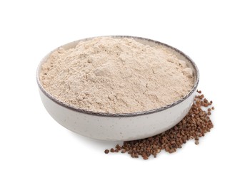 Photo of Bowl with buckwheat flour and grains on white background