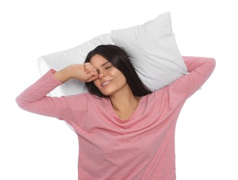 Sleepy young woman with soft pillow on white background