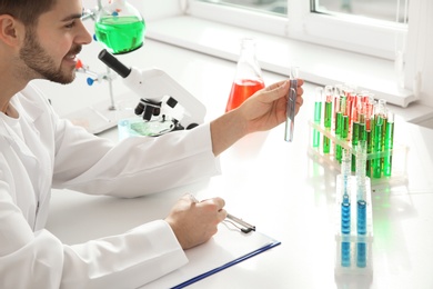 Photo of Medical student working in modern scientific laboratory