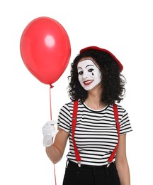 Photo of Funny mine with balloon posing on white background