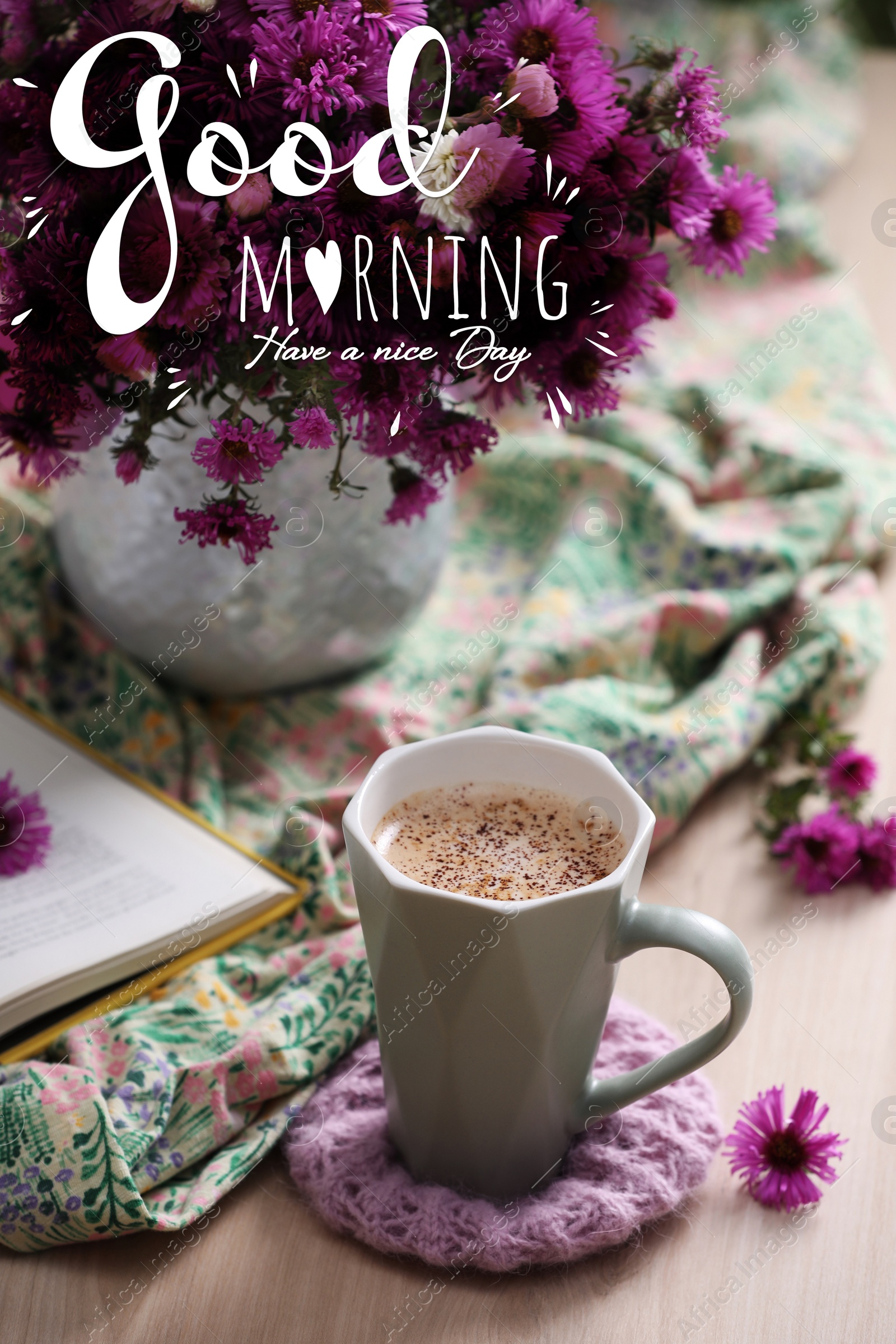 Image of Good morning! Cup of aromatic coffee, beautiful flowers and bright cloth on wooden table