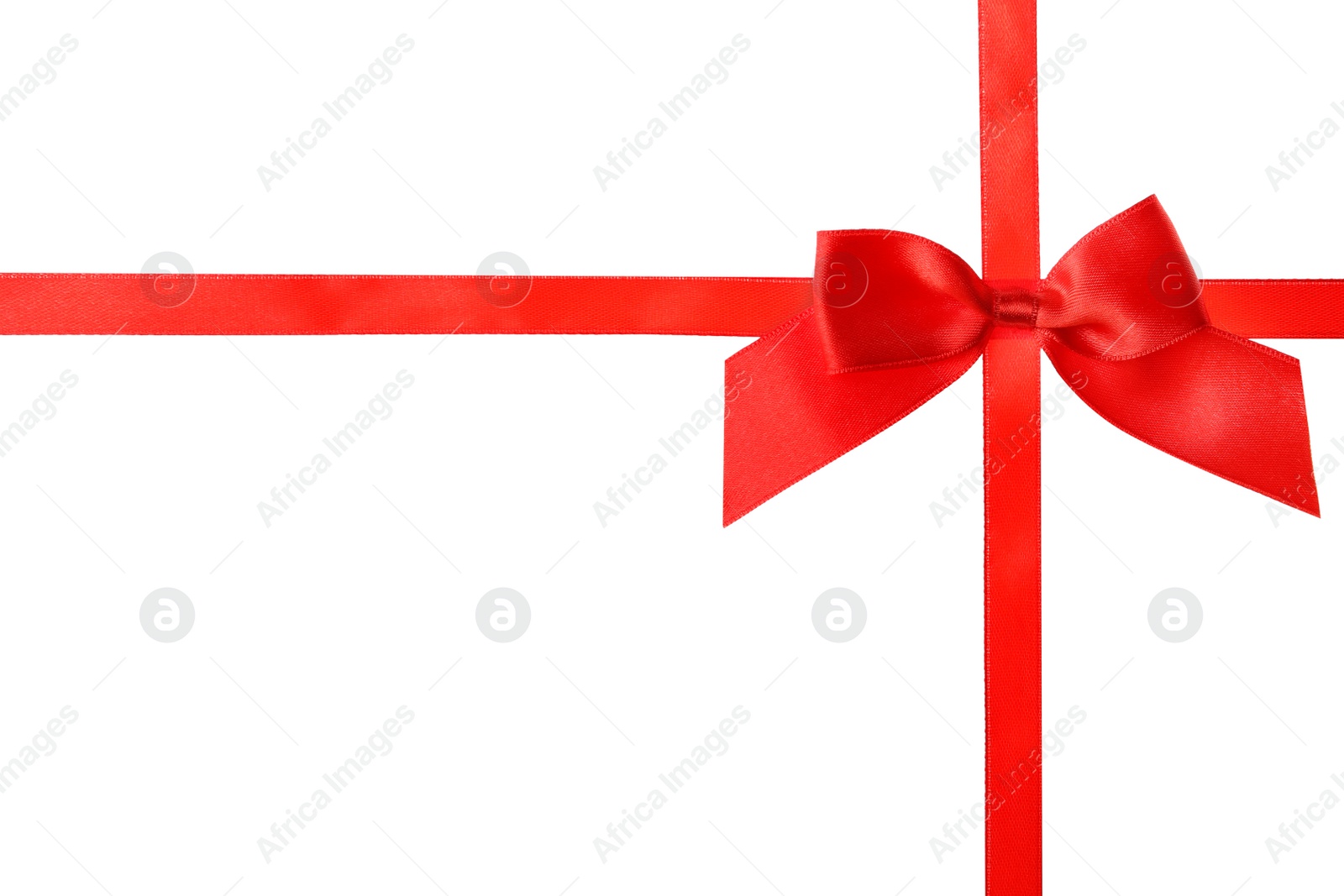 Photo of Red ribbon with bow on white background. Festive decoration