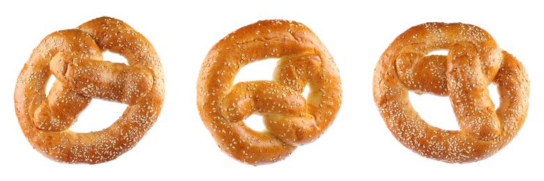 Image of Set with tasty freshly baked pretzels on white background. Banner design