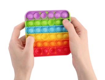 Woman using pop it fidget toy on white background, closeup