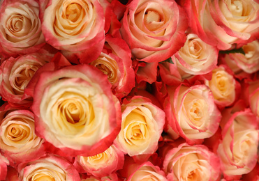 Photo of Beautiful bouquet of fresh roses, closeup. Floral decor