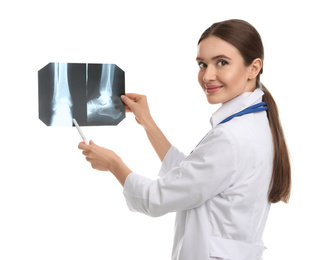 Orthopedist holding X-ray picture on white background