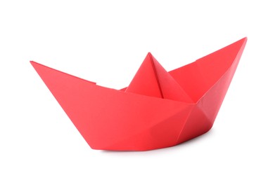 Photo of Handmade red paper boat isolated on white. Origami art