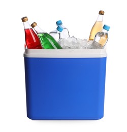 Photo of Blue plastic cool box with ice cubes and refreshing drinks on white background