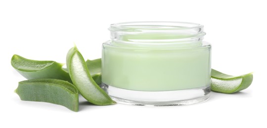 Photo of Jar of natural cream and cut aloe leaves isolated on white