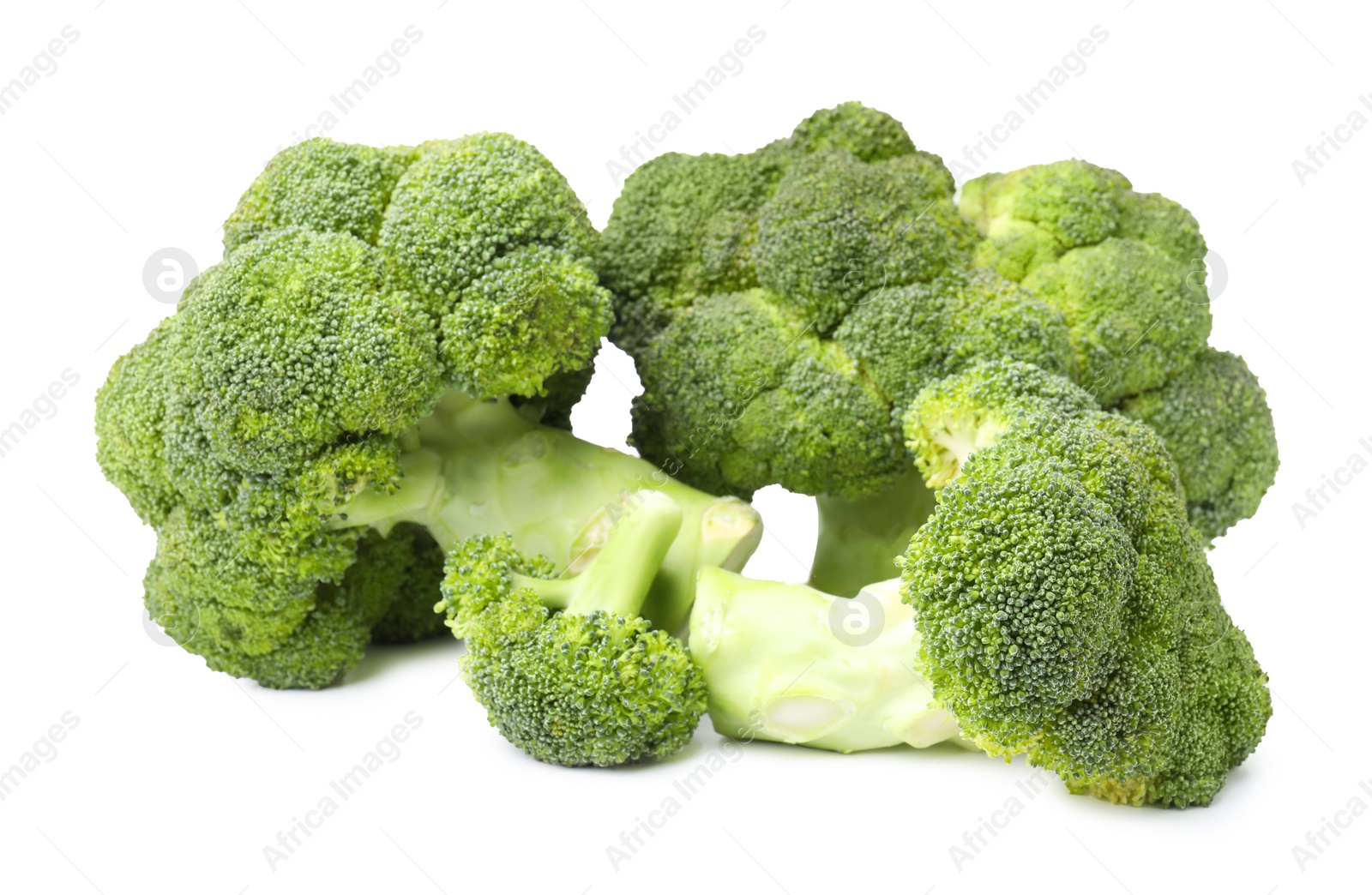 Photo of Pile of fresh raw green broccoli isolated on white