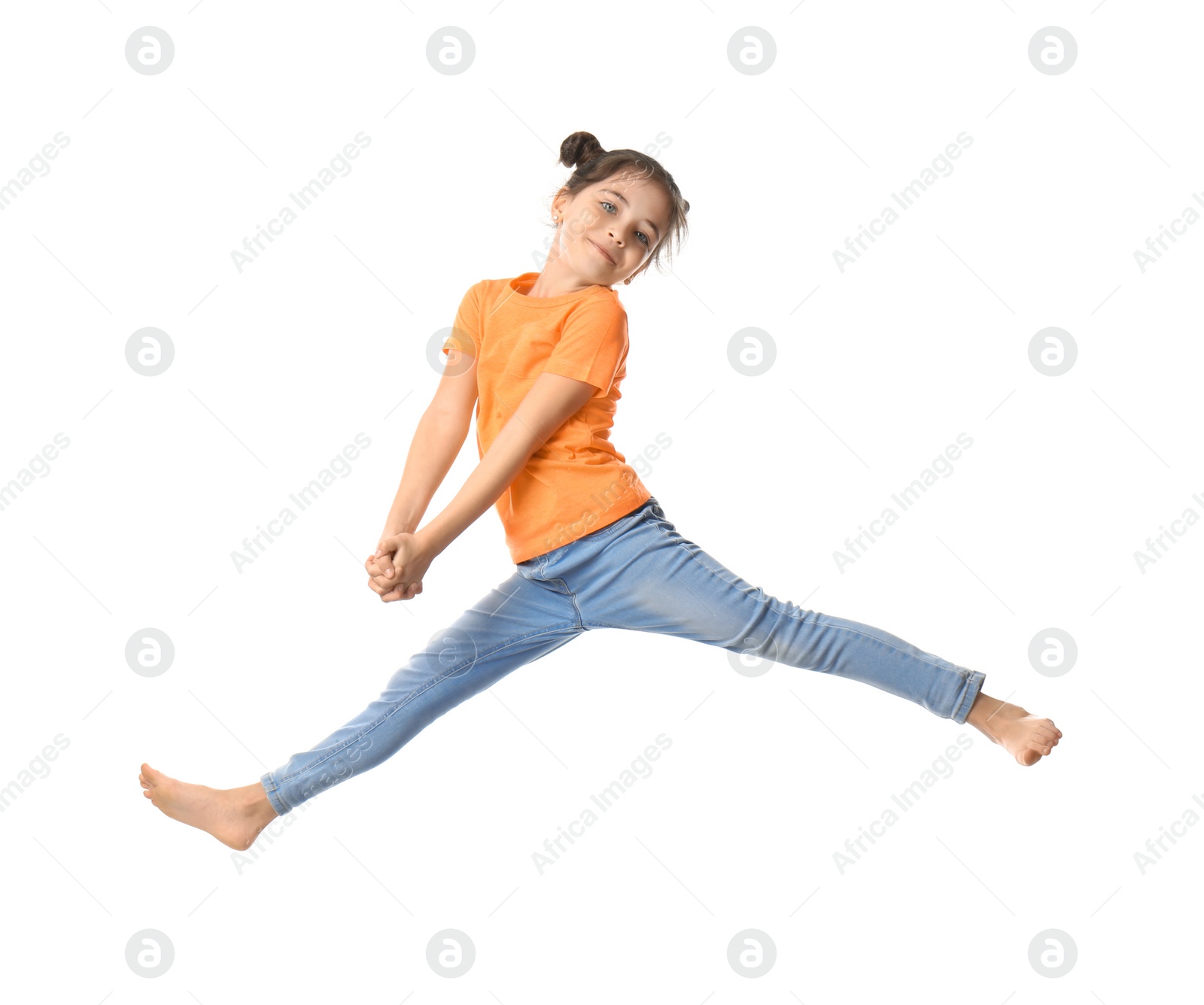 Photo of Cute little girl jumping on white background