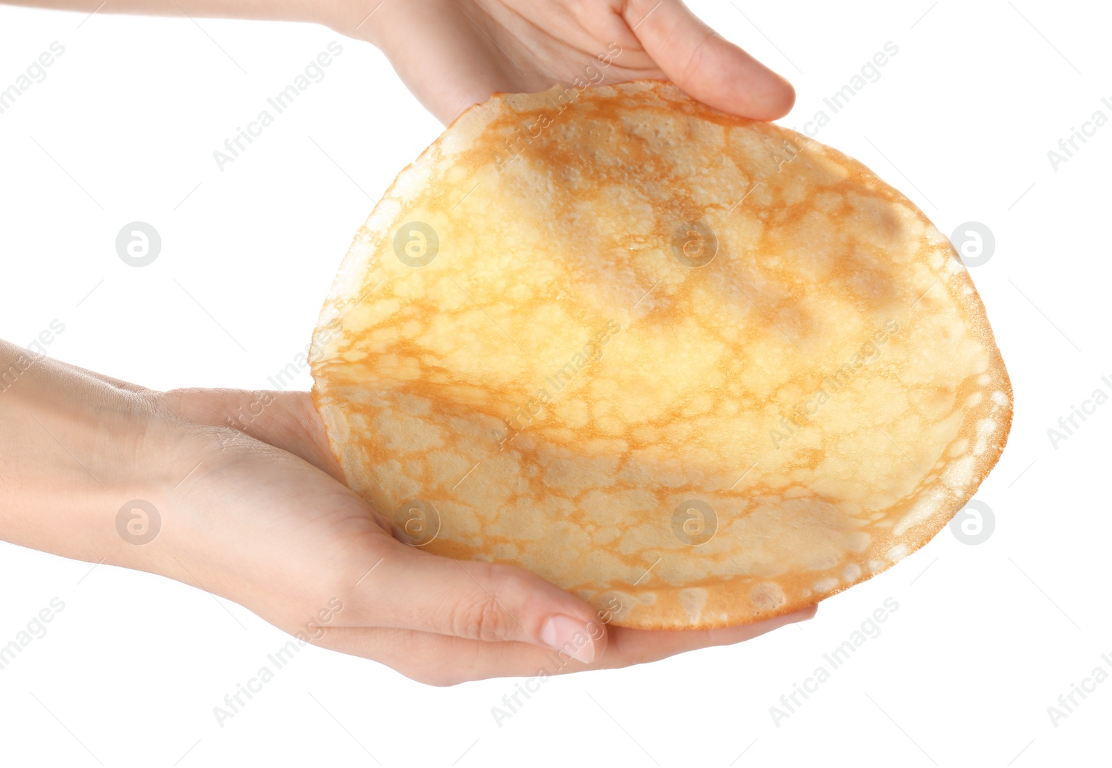 Photo of Woman holding tasty thin pancake on white background, closeup