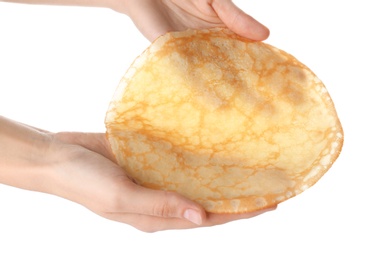 Photo of Woman holding tasty thin pancake on white background, closeup