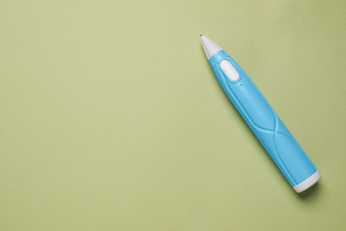 Photo of Stylish 3D pen on olive background, top view. Space for text