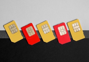 Photo of Different SIM cards on color background, flat lay