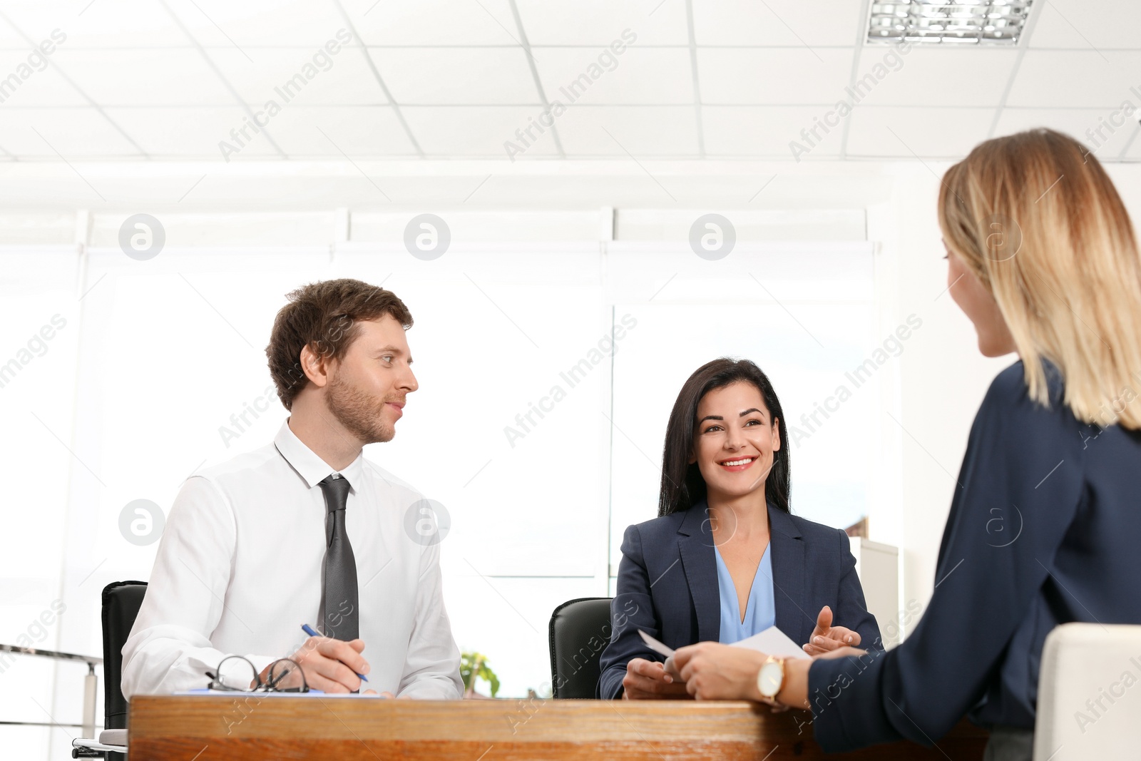 Photo of Human resources commission conducting job interview with applicant in office