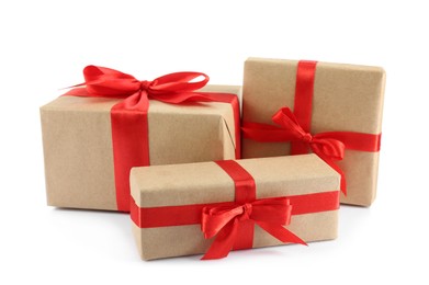 Beautiful gift boxes with red bows on white background