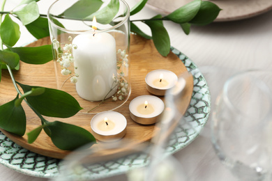Photo of Elegant table setting with green plants, closeup