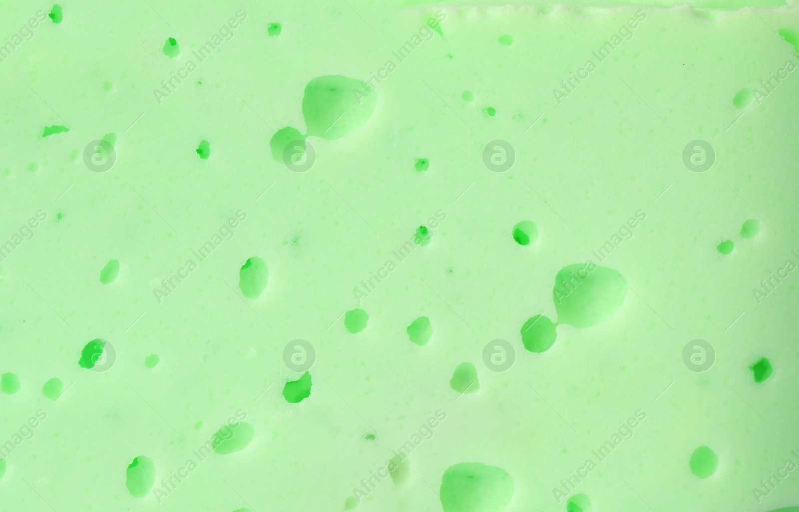 Photo of Closeup view of green slime. Antistress toy