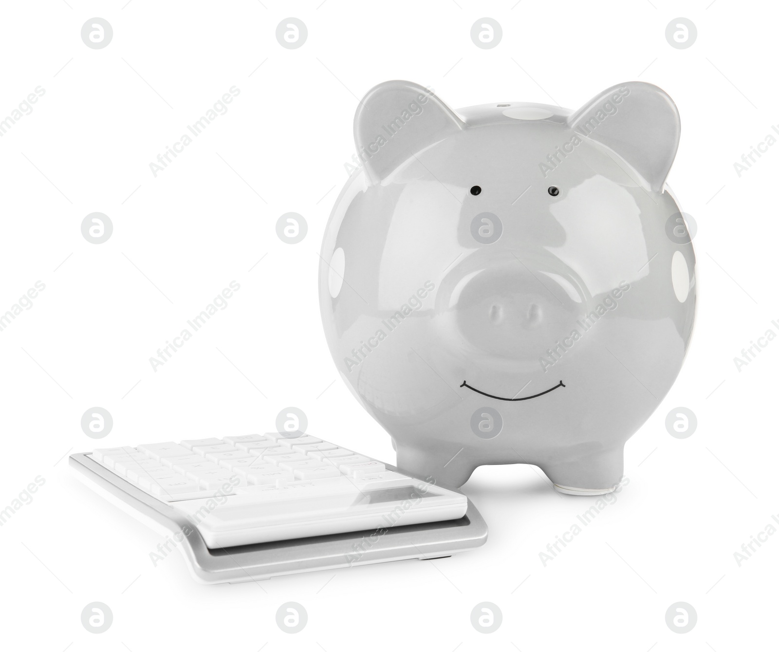 Photo of Calculator and grey piggy bank isolated on white