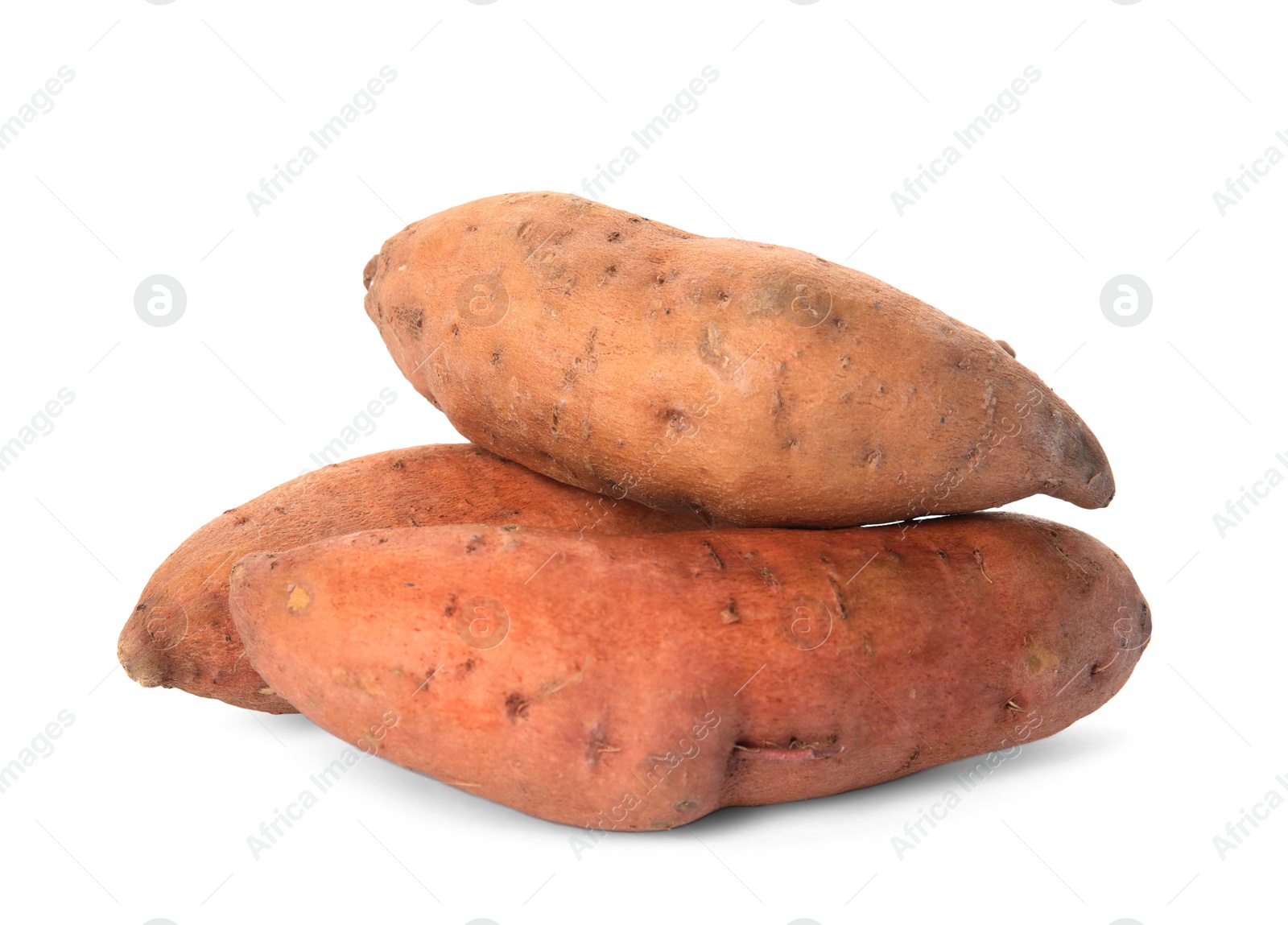 Photo of Heap of whole ripe sweet potatoes on white background