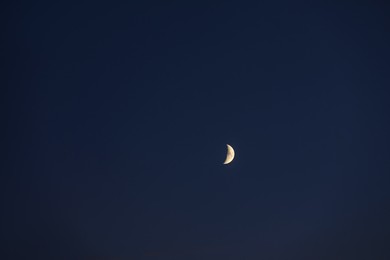 Beautiful bright white crescent in dark blue sky