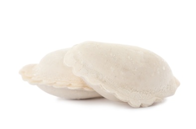 Raw dumplings with tasty filling on white background