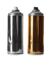 Photo of Cans of different spray paints on white background