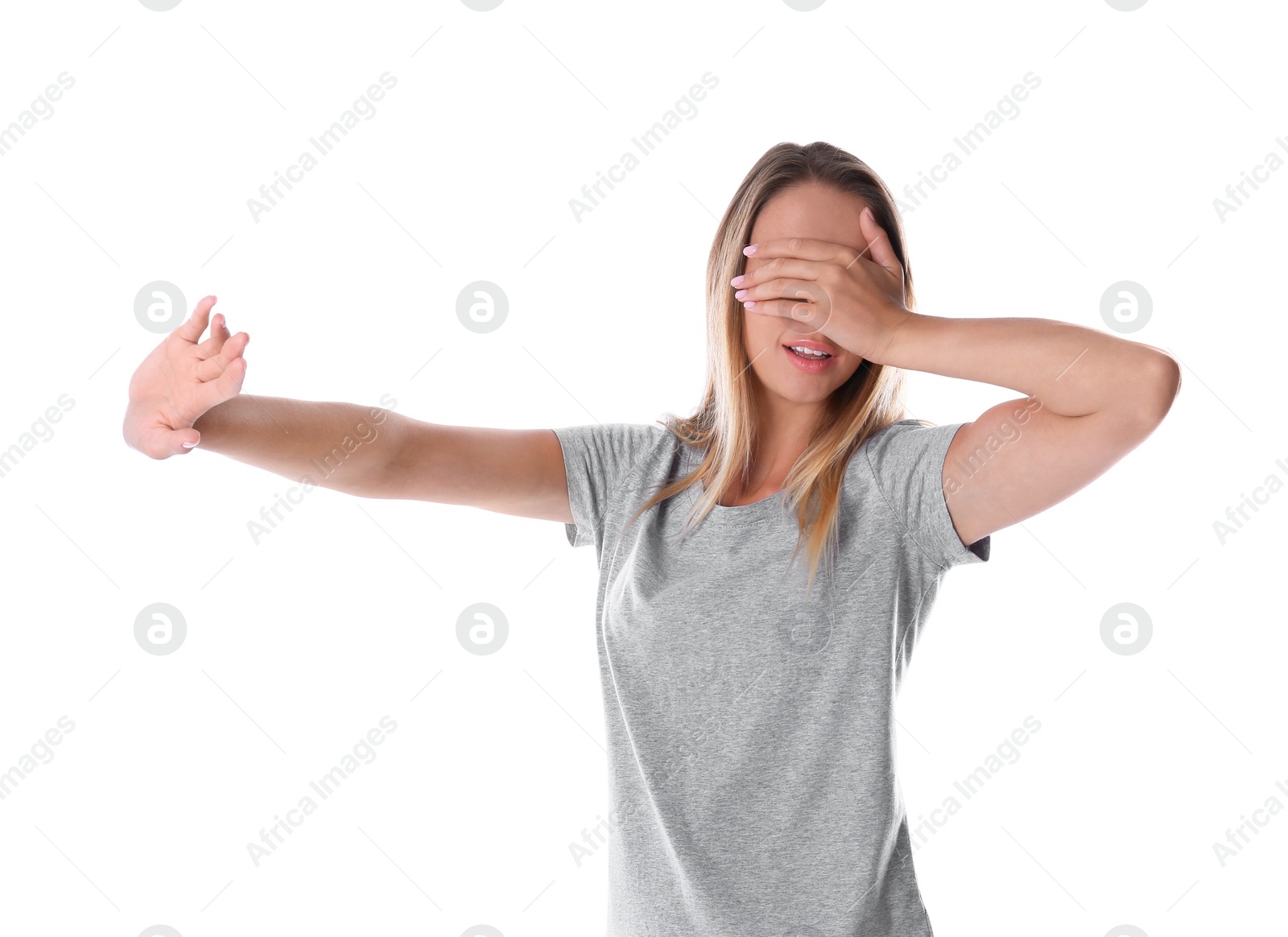 Photo of Young woman covering eyes with hands on white background