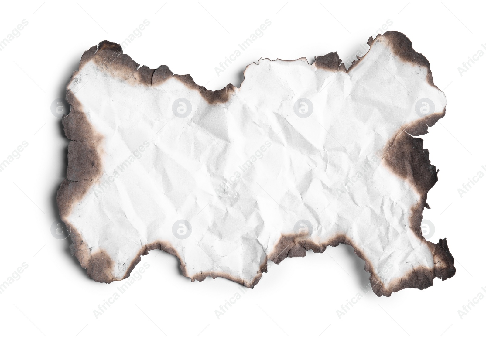 Photo of Piece of crumpled paper with dark burnt borders on white background, top view. Space for text