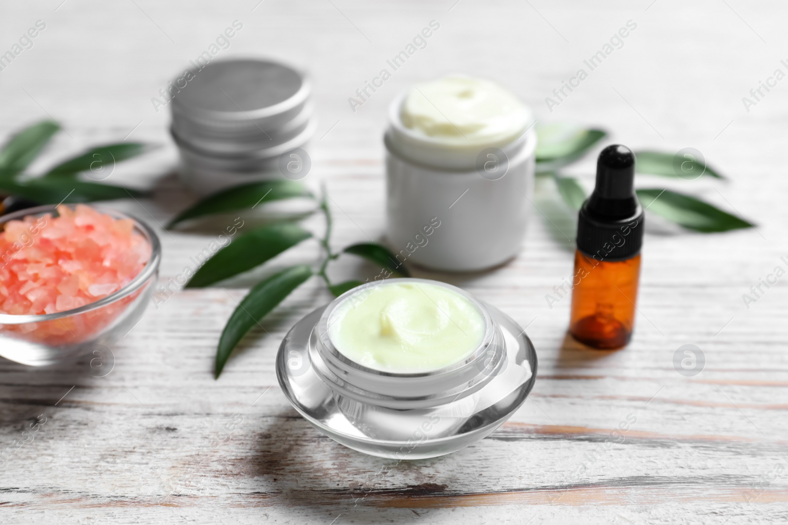 Photo of Cosmetic products on wooden background